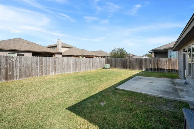 a view of a backyard with a small cabin