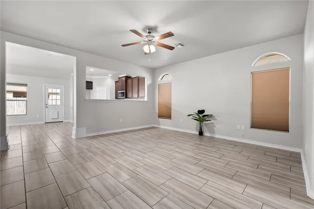 a view of a room with wooden floor and cabinet