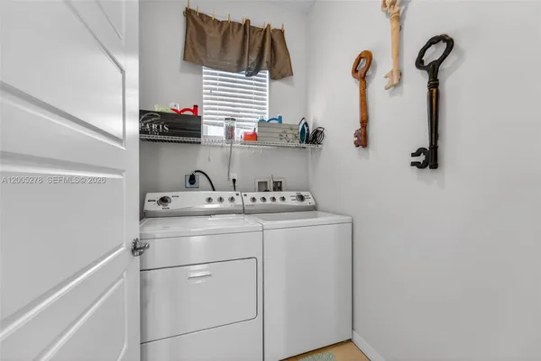 a bathroom with a sink and a washing machine
