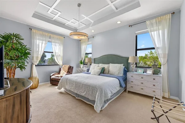 a bedroom with a bed and a potted plant