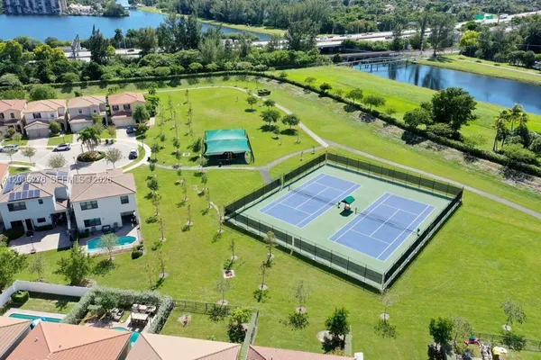 a view of a park with palm trees