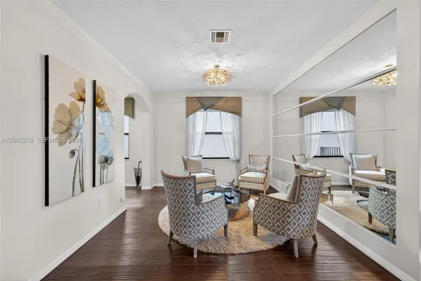 a living room with furniture and a window