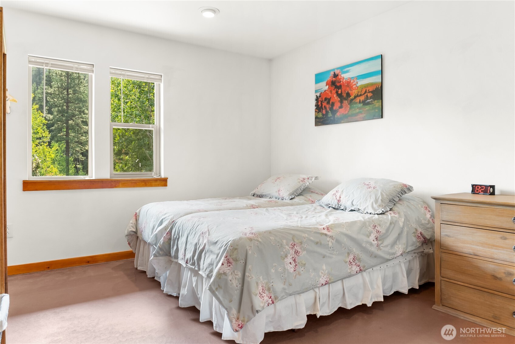 96 Alder Creek Road Twisp, WA 98856 - Photo 17 of 40 a bedroom with a bed and a painting on the wall