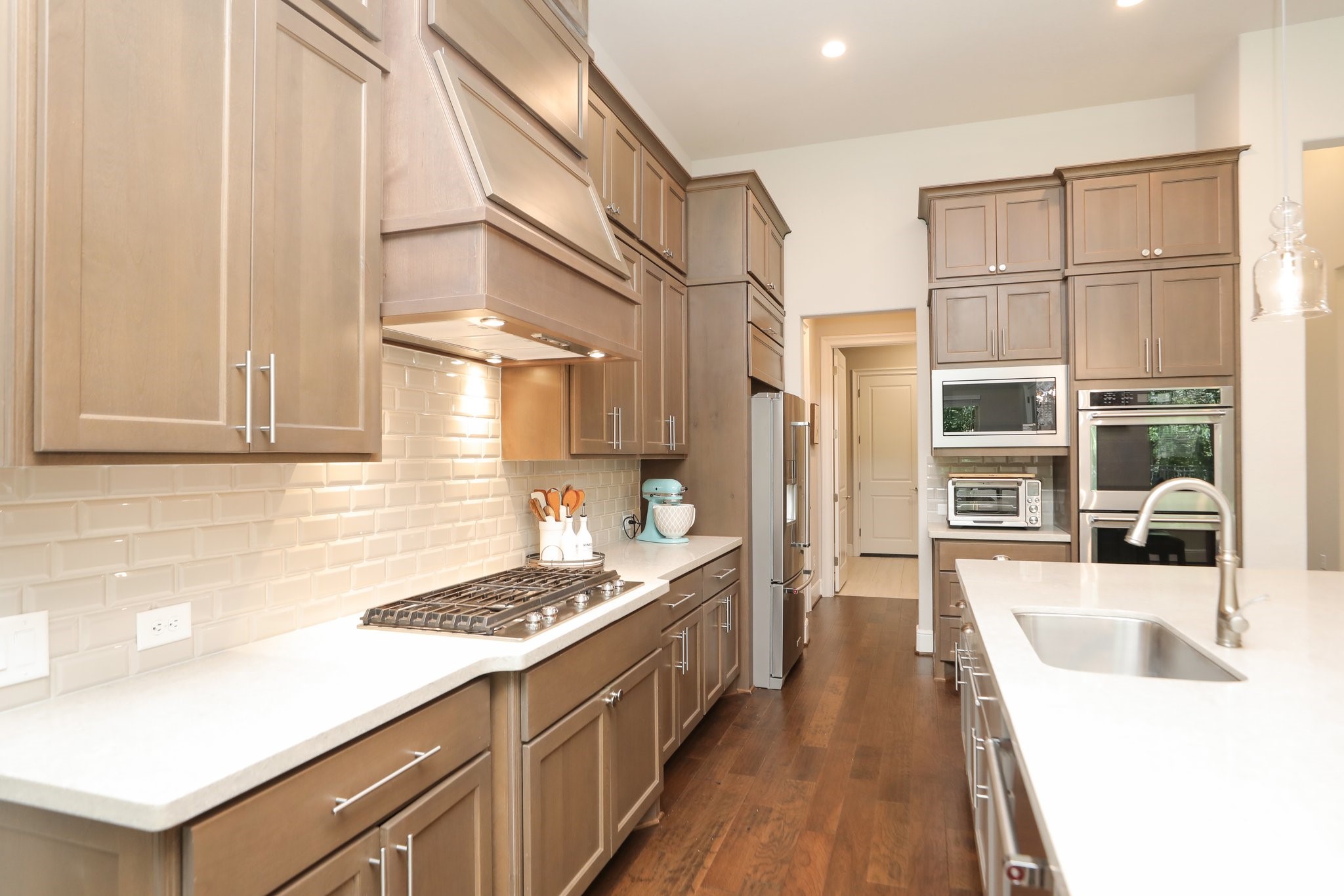 8511 Tynan Ridge Drive Magnolia, TX 77354 - Photo 18 of 50 a kitchen with stainless steel appliances granite countertop a stove and a refrigerator