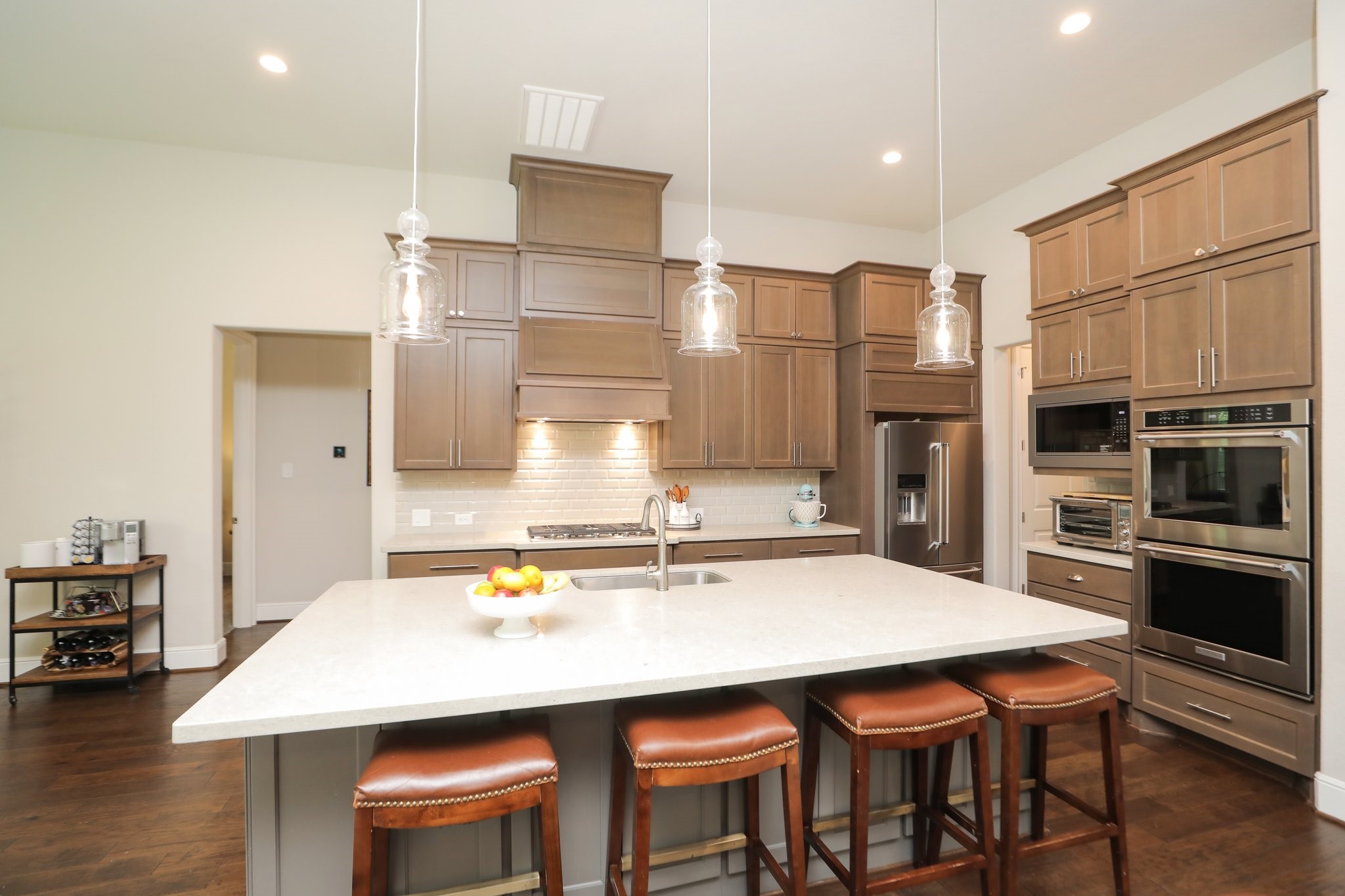 8511 Tynan Ridge Drive Magnolia, TX 77354 - Photo 19 of 50 a kitchen with stainless steel appliances a sink and white cabinets