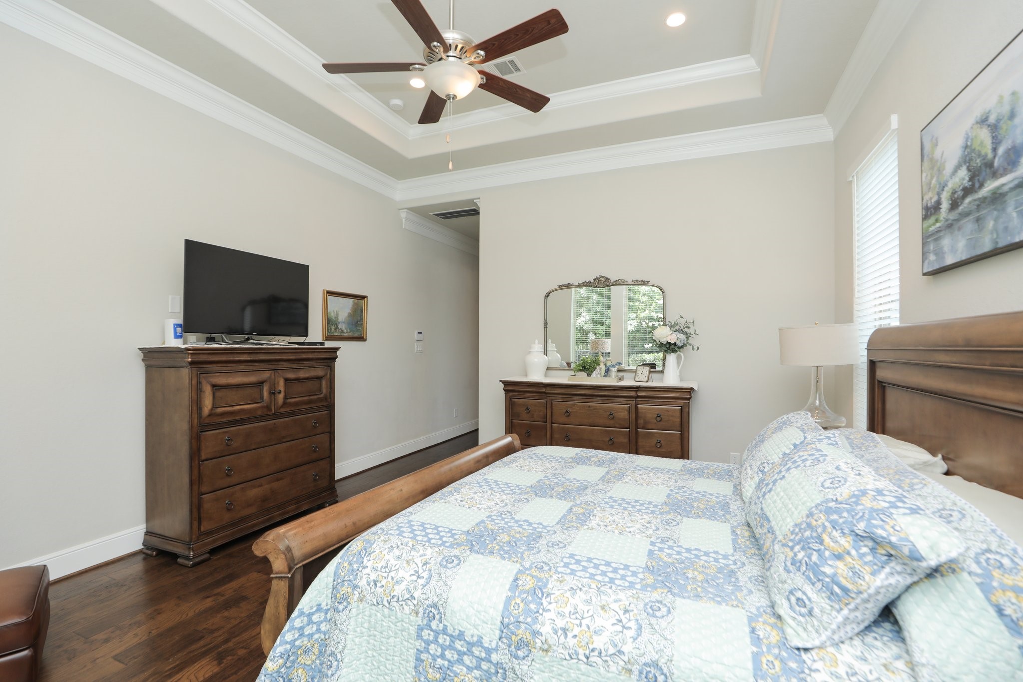 8511 Tynan Ridge Drive Magnolia, TX 77354 - Photo 22 of 50 a bedroom with a bed and a flat tv screen on dresser