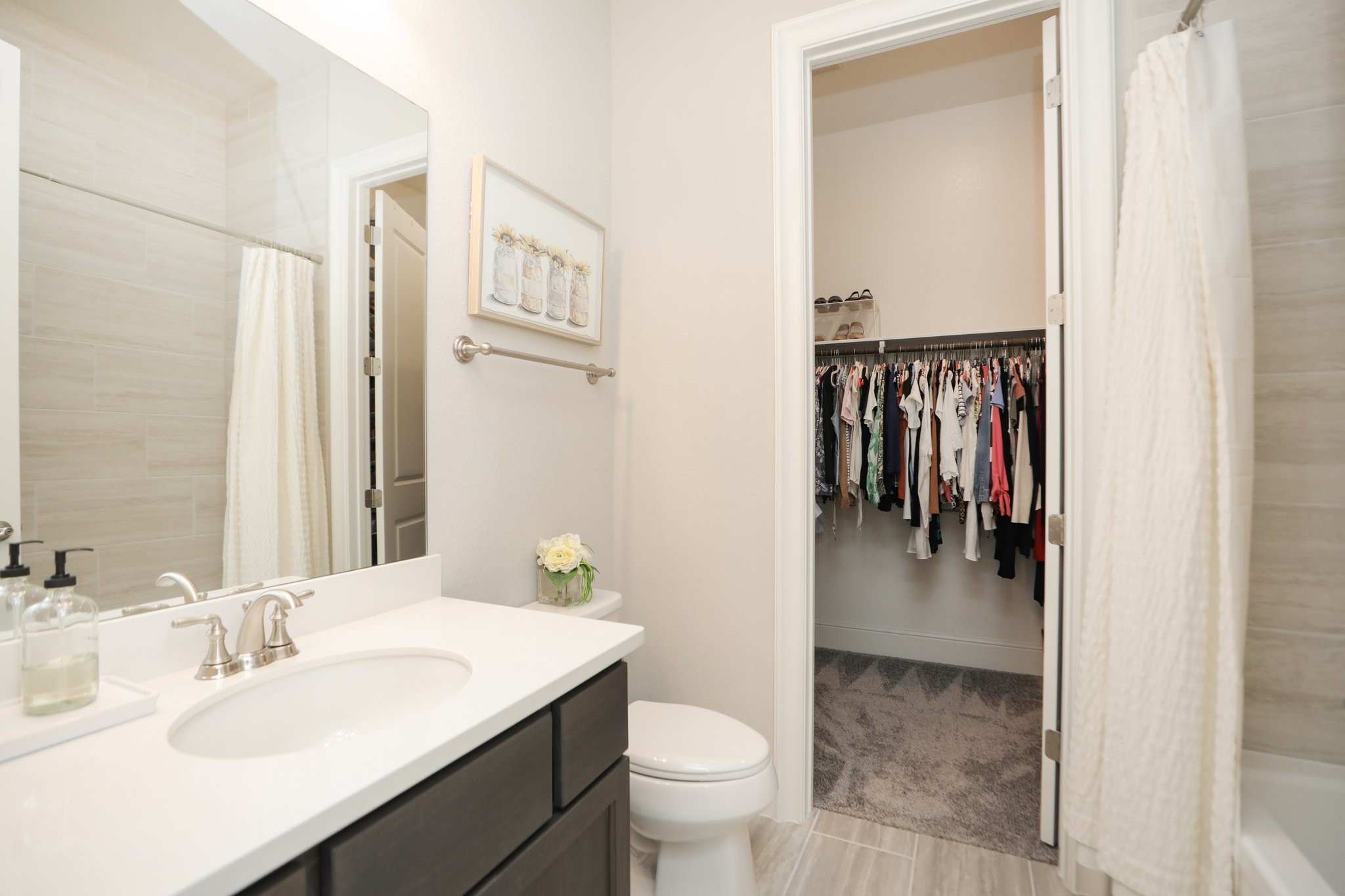 8511 Tynan Ridge Drive Magnolia, TX 77354 - Photo 28 of 50 a en suite bathroom with a sink a toilet and a mirror