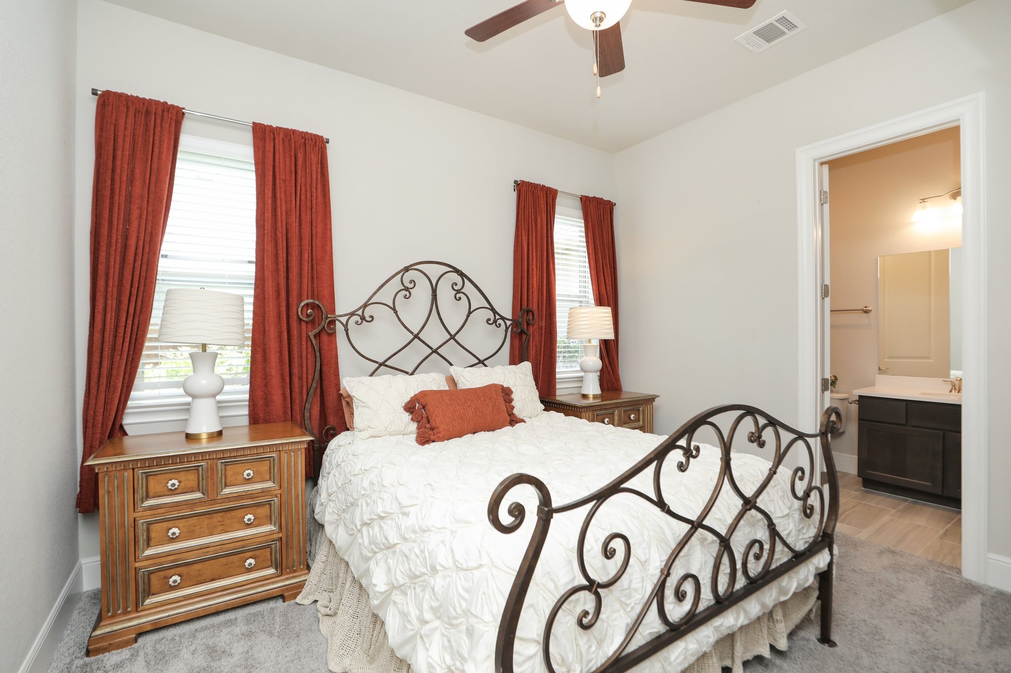 8511 Tynan Ridge Drive Magnolia, TX 77354 - Photo 29 of 50 One of three secondary bedrooms, this room features its own private ensuite bathroom, offering comfort and privacy for family or guests.