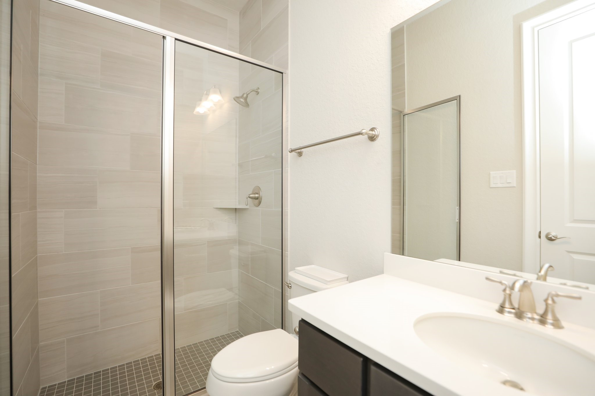 8511 Tynan Ridge Drive Magnolia, TX 77354 - Photo 34 of 50 a bathroom with a sink toilet and shower