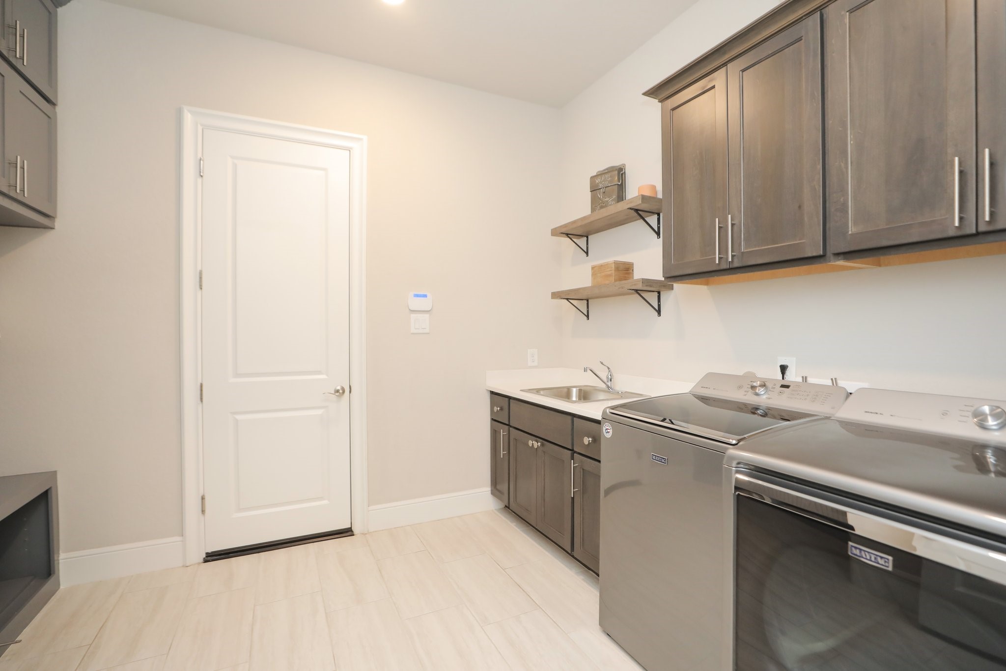 8511 Tynan Ridge Drive Magnolia, TX 77354 - Photo 37 of 50 a kitchen with stainless steel appliances granite countertop a sink and a stove top oven
