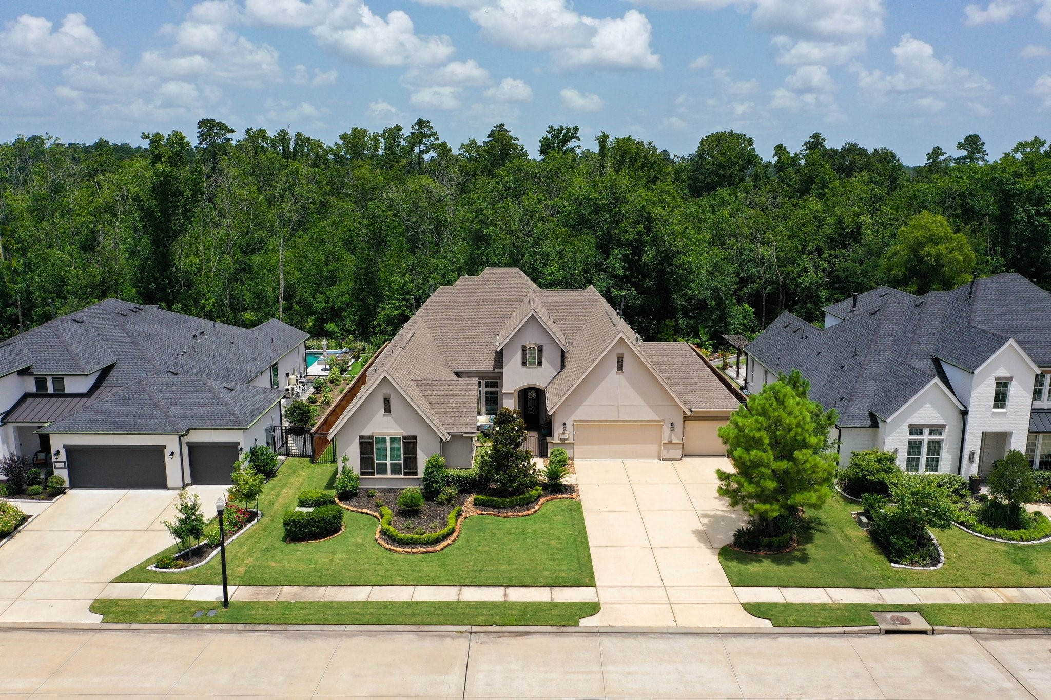 8511 Tynan Ridge Drive Magnolia, TX 77354 - Photo 50 of 50 Welcome home to 8511 Tynan Ridge, Magnolia, Texas 77354 – a stunning Toll Brothers residence featuring the coveted Lowell Chateau plan. This sought-after 1.5 story home showcases a beautifully open-concept design with elegant architectural details, soaring ceilings, and abundant natural light. From the moment you arrive, the curb appeal and thoughtful layout invite you in to experience refined comfort and style in every space.