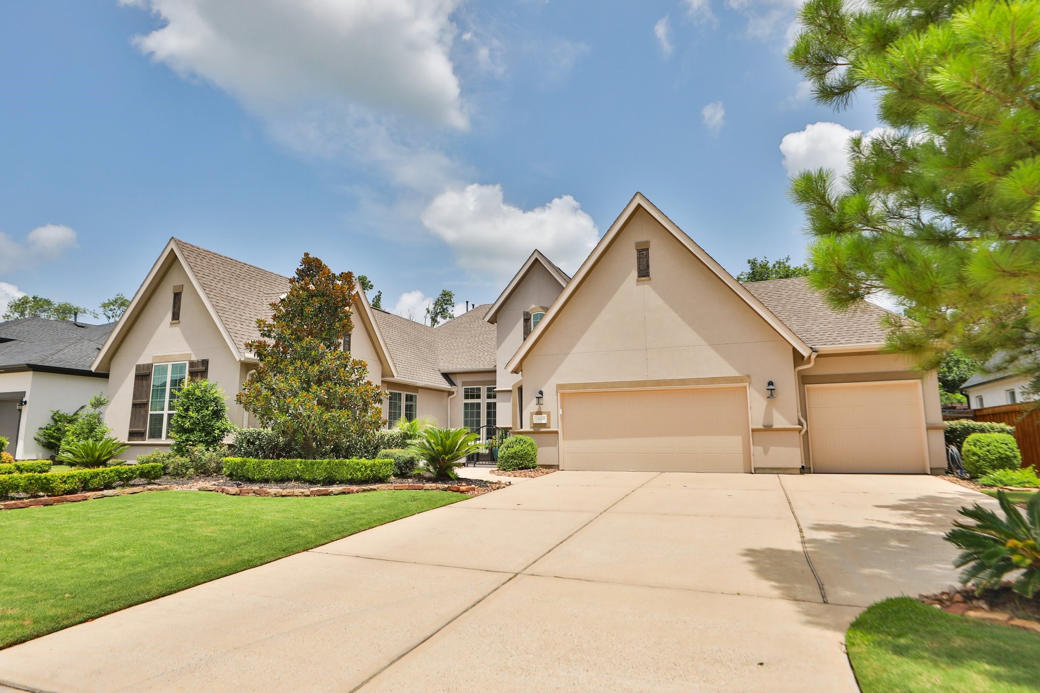 8511 Tynan Ridge Drive Magnolia, TX 77354 - Photo 6 of 50 a front view of a house with a yard and garage