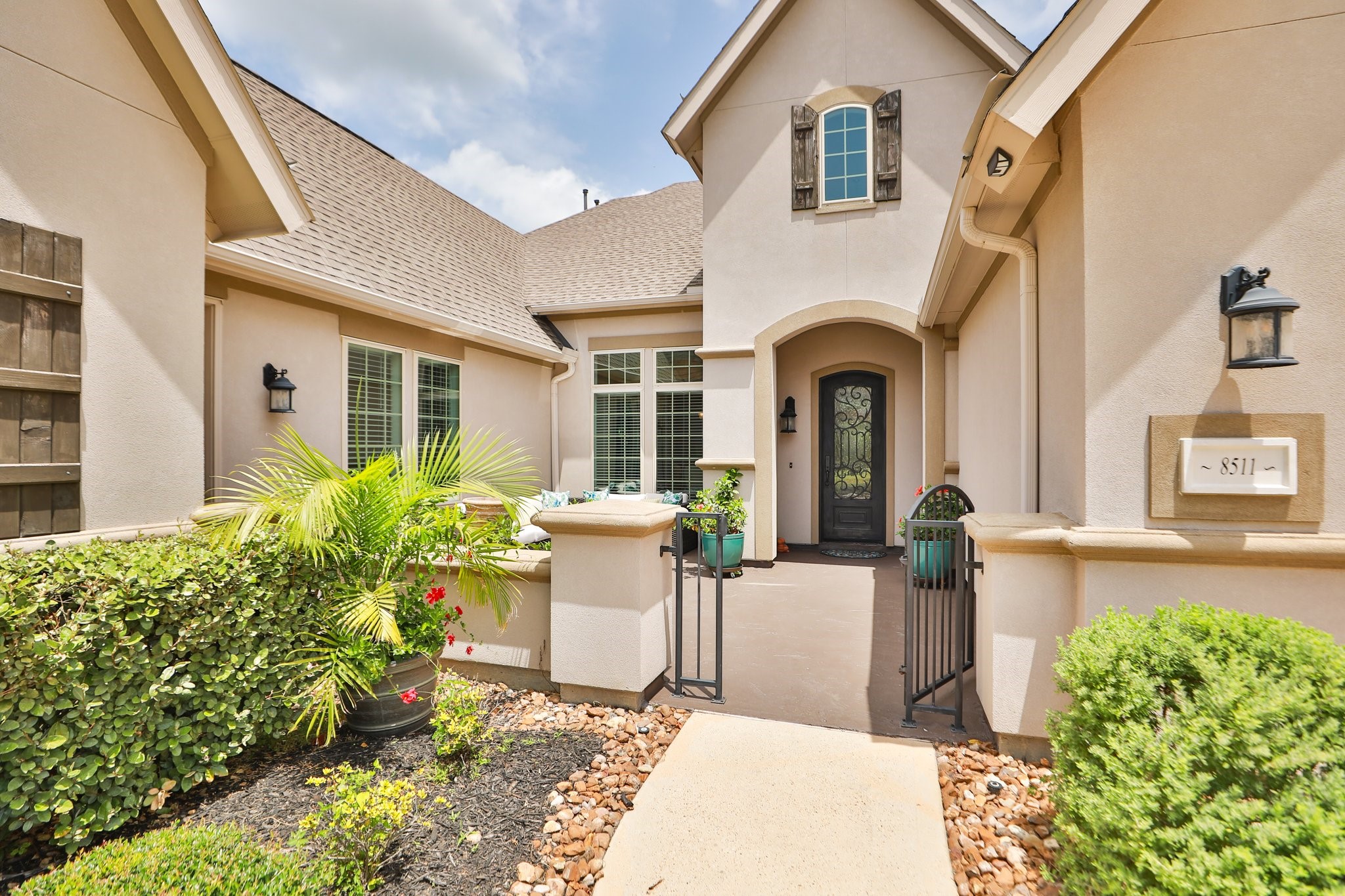 8511 Tynan Ridge Drive Magnolia, TX 77354 - Photo 7 of 50 Your family and guests will be greeted by a beautiful courtyard entry, an inviting space to gather and enjoy your favorite beverage. A separate side entrance leads to a versatile area that could serve perfectly as guest quarters.