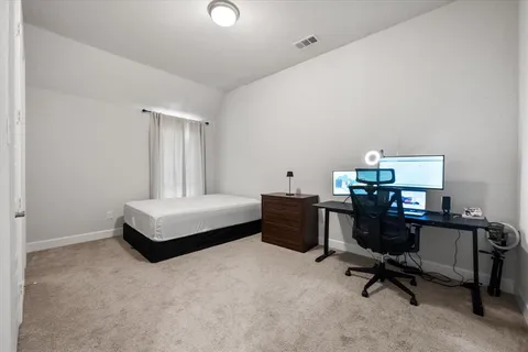 a room with furniture and a flat screen tv