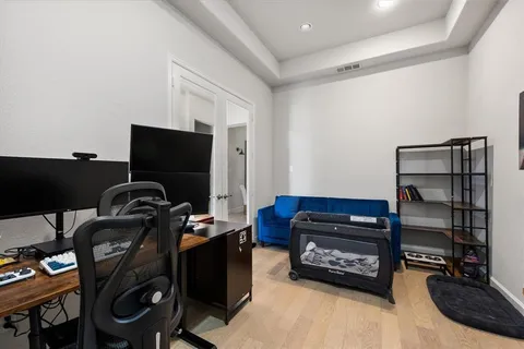 a room with toys and a flat screen tv