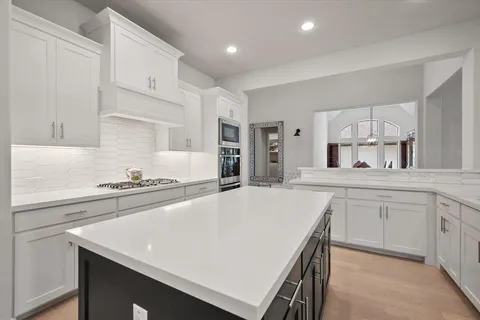 a kitchen with a sink and cabinets