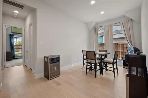 a dining room with a table and chairs