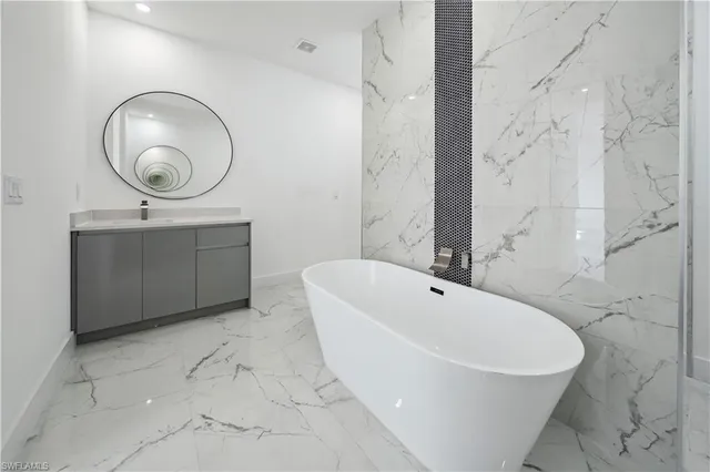 an empty room with a ceiling fan and carpet