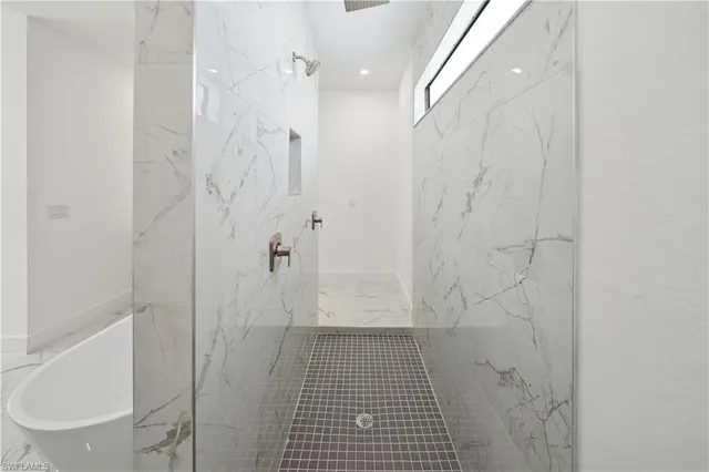 a bathroom with a bathtub and a sink