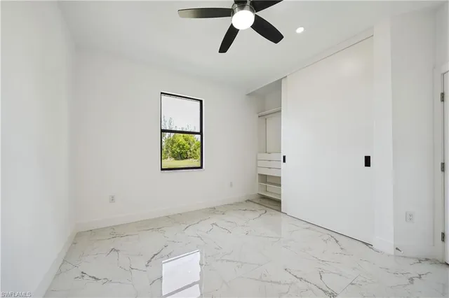 a bathroom with a sink a toilet and a shower