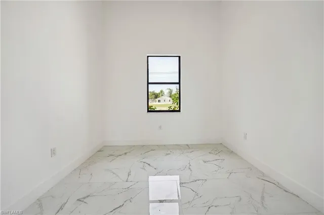 a white toilet sitting in a bathroom