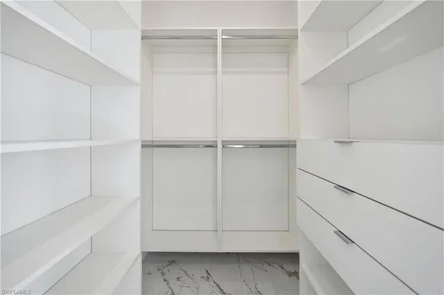 a view of an empty walk in closet