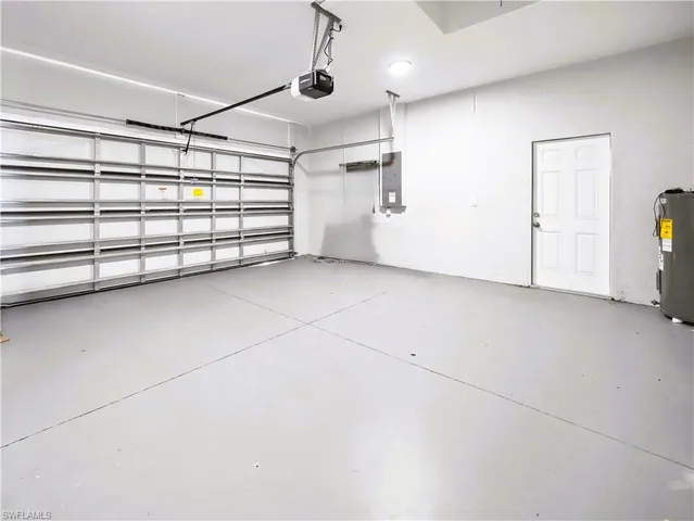 a yellow house with river in front of it