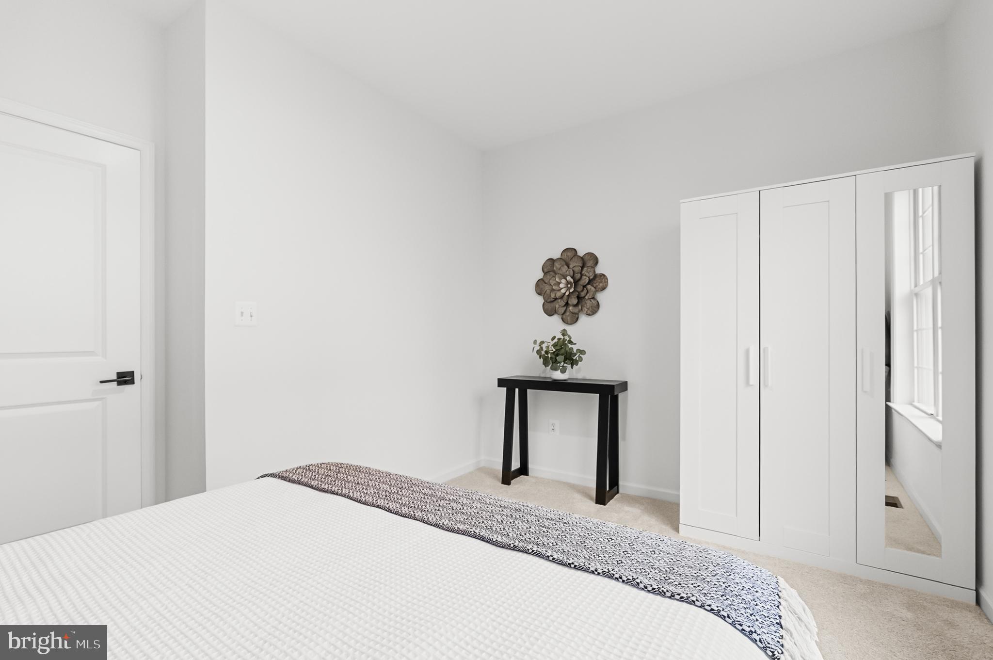 4603 Thoroughbred Drive Upper Marlboro, MD 20772 - Photo 11 of 64 a bedroom with a bed and a painting on the wall