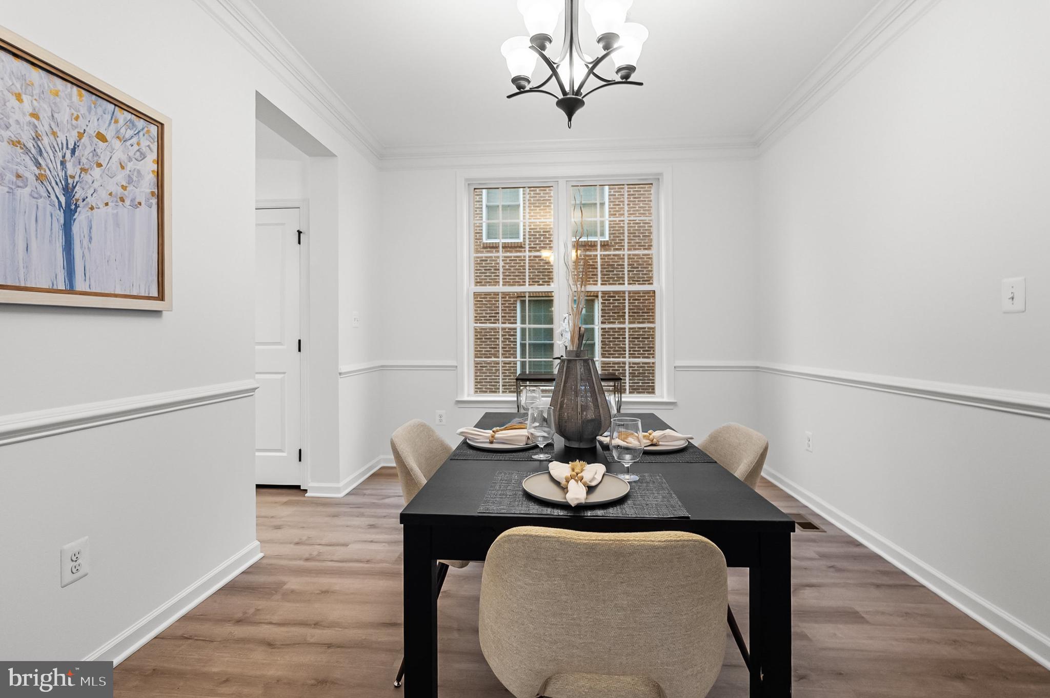 4603 Thoroughbred Drive Upper Marlboro, MD 20772 - Photo 14 of 64 a view of a dining room with furniture window and wooden floor