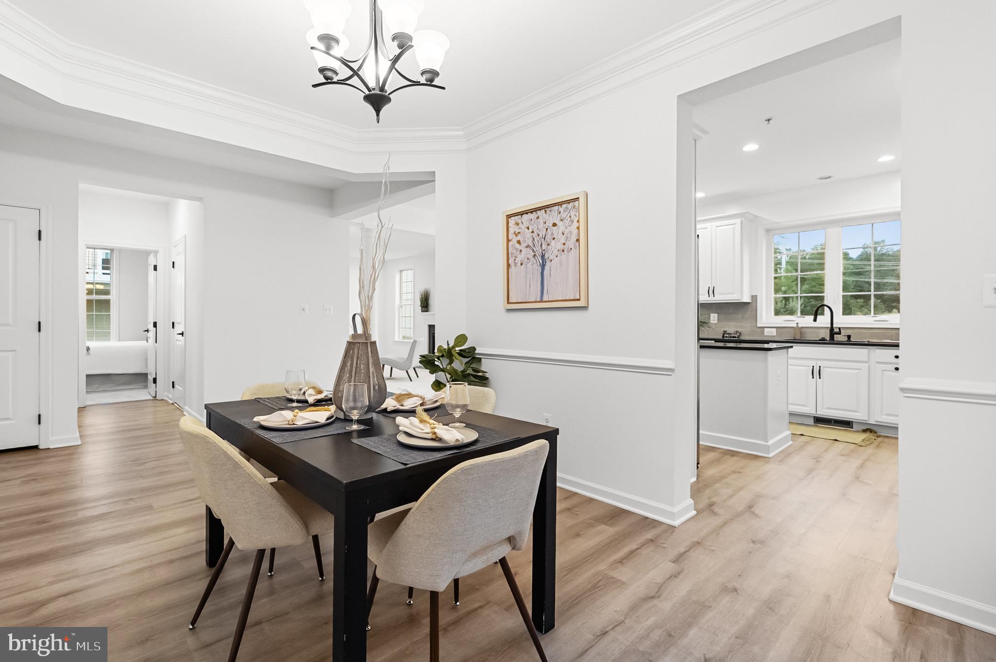 4603 Thoroughbred Drive Upper Marlboro, MD 20772 - Photo 15 of 64 a view of a dining room with furniture and wooden floor