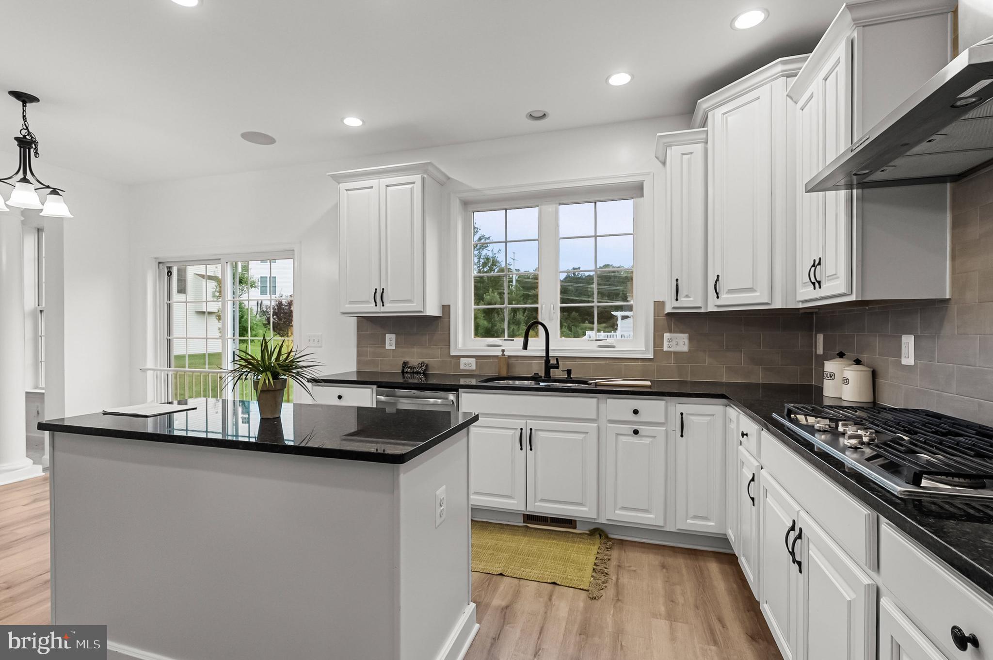 4603 Thoroughbred Drive Upper Marlboro, MD 20772 - Photo 16 of 64 a kitchen with stainless steel appliances granite countertop a sink a stove and cabinets