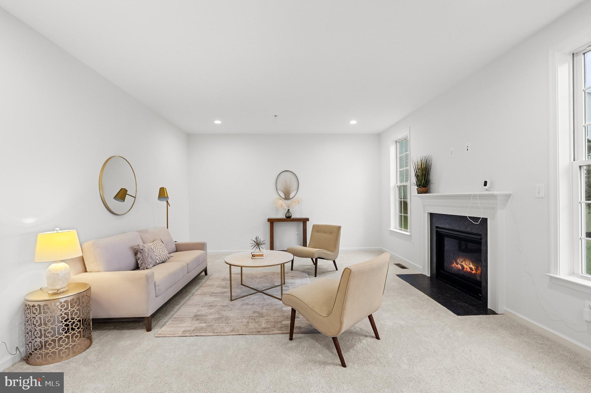 4603 Thoroughbred Drive Upper Marlboro, MD 20772 - Photo 20 of 64 a living room with furniture and a fireplace