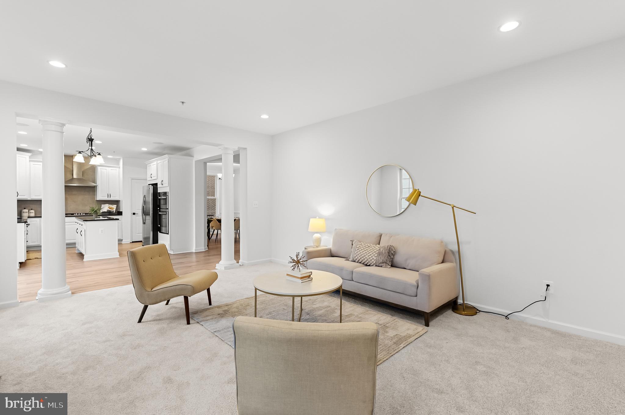4603 Thoroughbred Drive Upper Marlboro, MD 20772 - Photo 21 of 64 a living room with furniture and a table