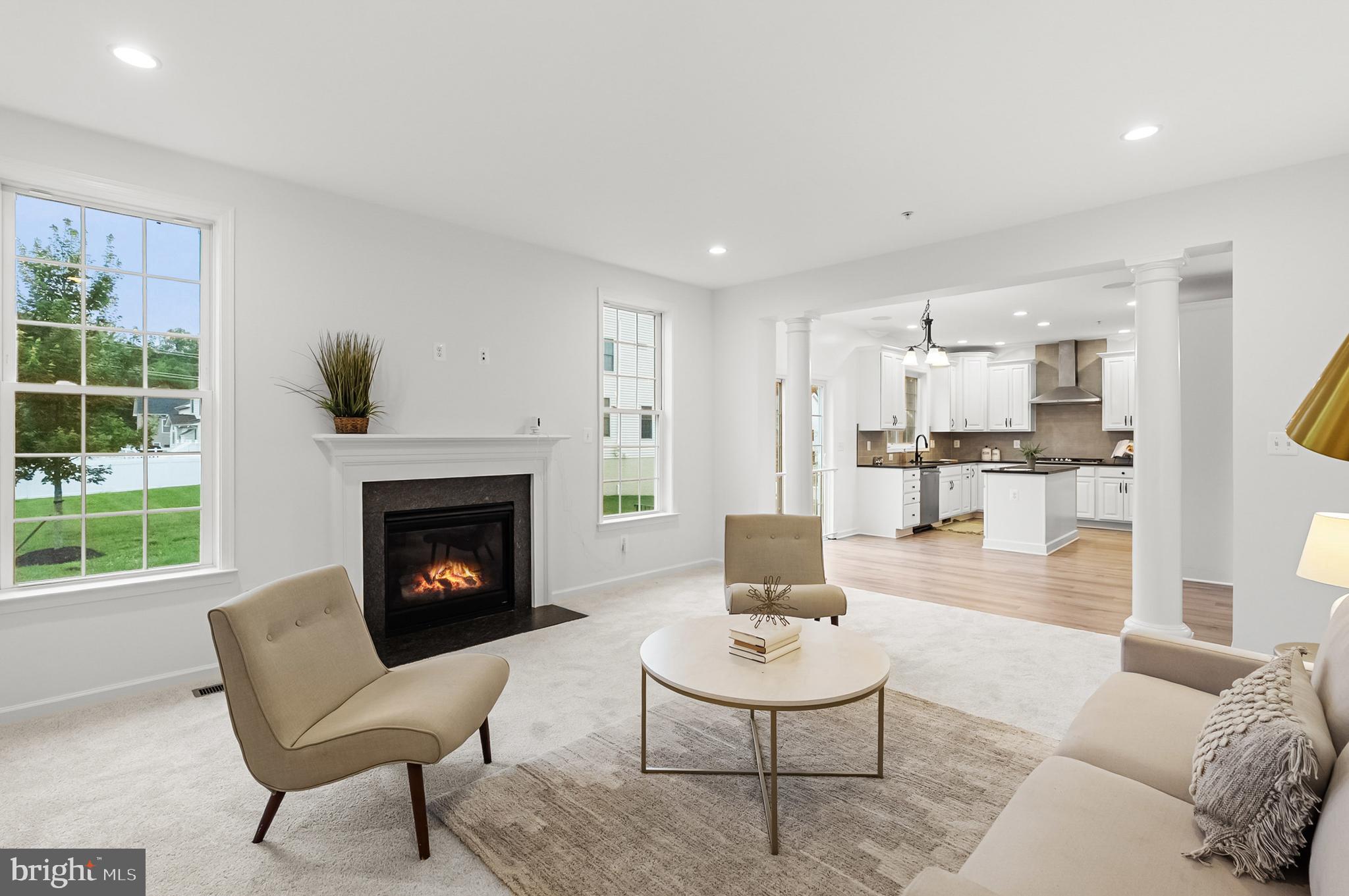 4603 Thoroughbred Drive Upper Marlboro, MD 20772 - Photo 22 of 64 a living room with furniture and a fireplace