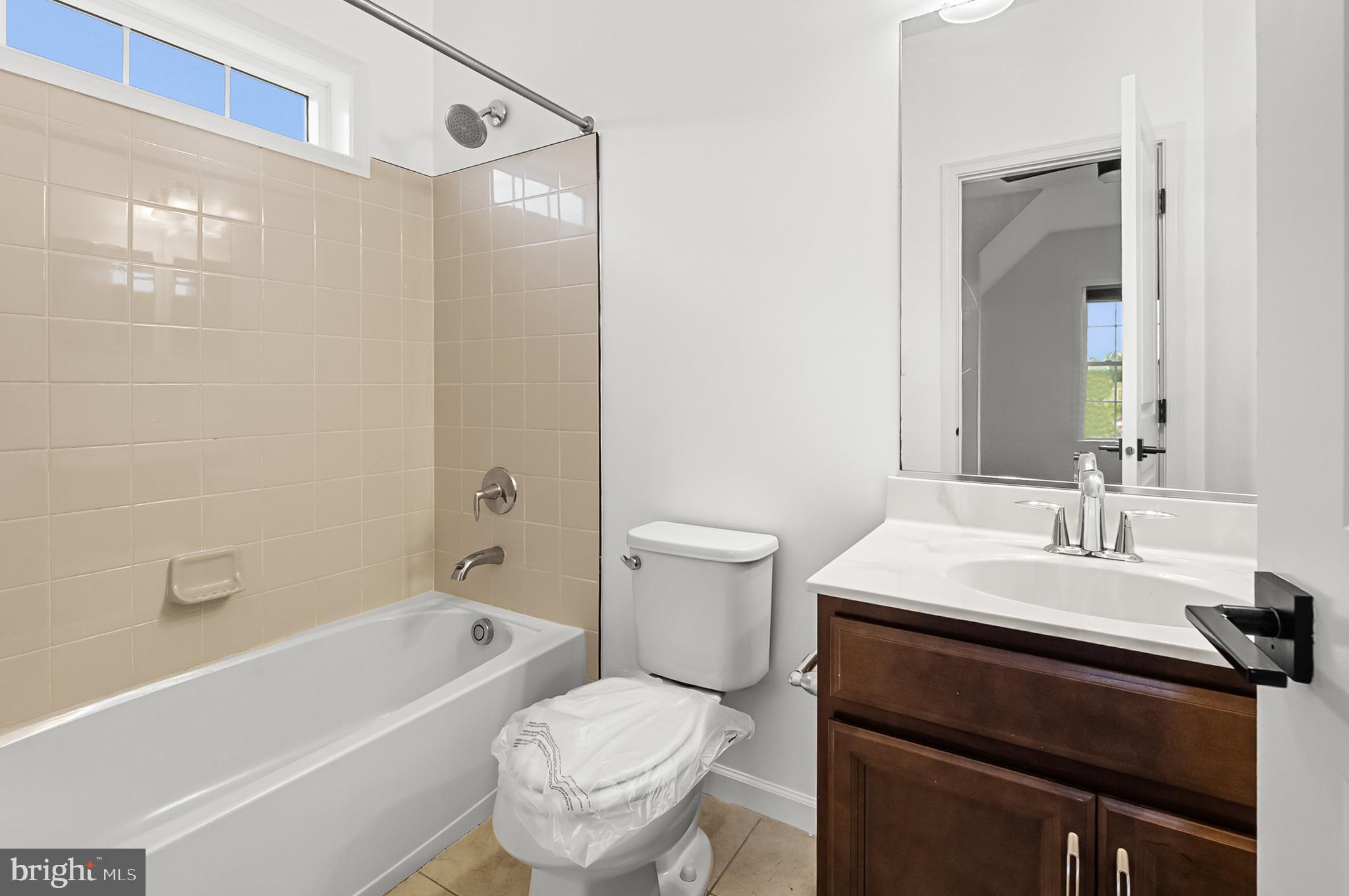 4603 Thoroughbred Drive Upper Marlboro, MD 20772 - Photo 34 of 64 a bathroom with a sink a toilet a mirror and shower