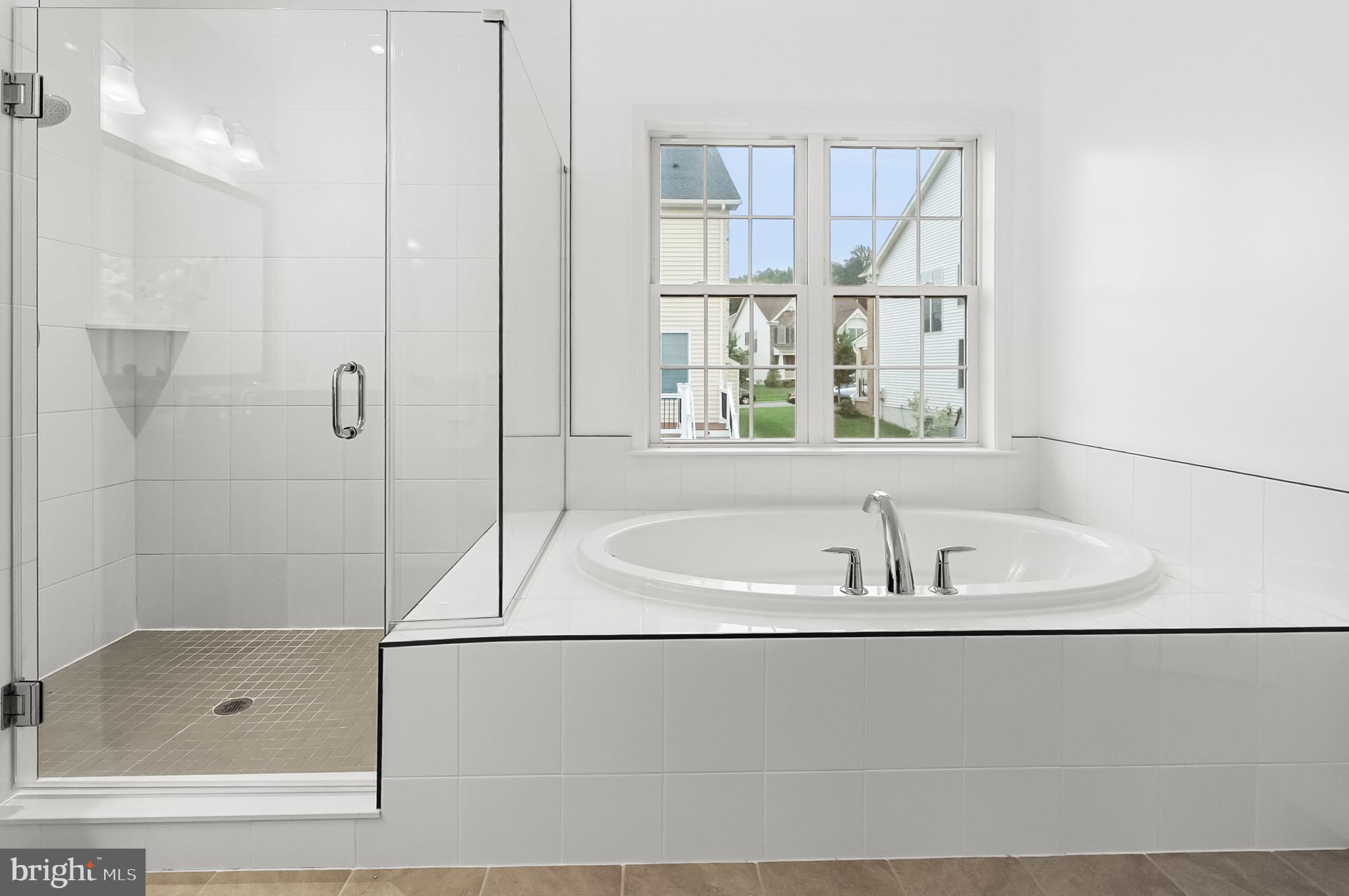 4603 Thoroughbred Drive Upper Marlboro, MD 20772 - Photo 41 of 64 a bathroom with a bath tub and a shower