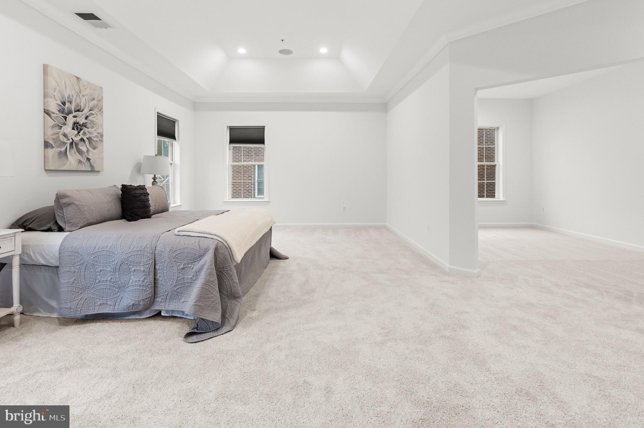 4603 Thoroughbred Drive Upper Marlboro, MD 20772 - Photo 42 of 64 a bedroom with a large bed and a couch