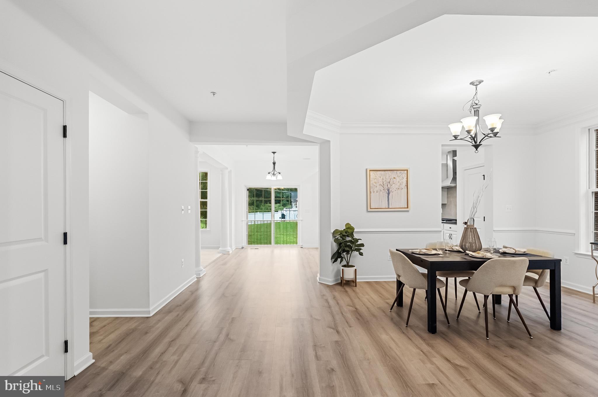 4603 Thoroughbred Drive Upper Marlboro, MD 20772 - Photo 7 of 64 a view of a dining room with furniture and wooden floor