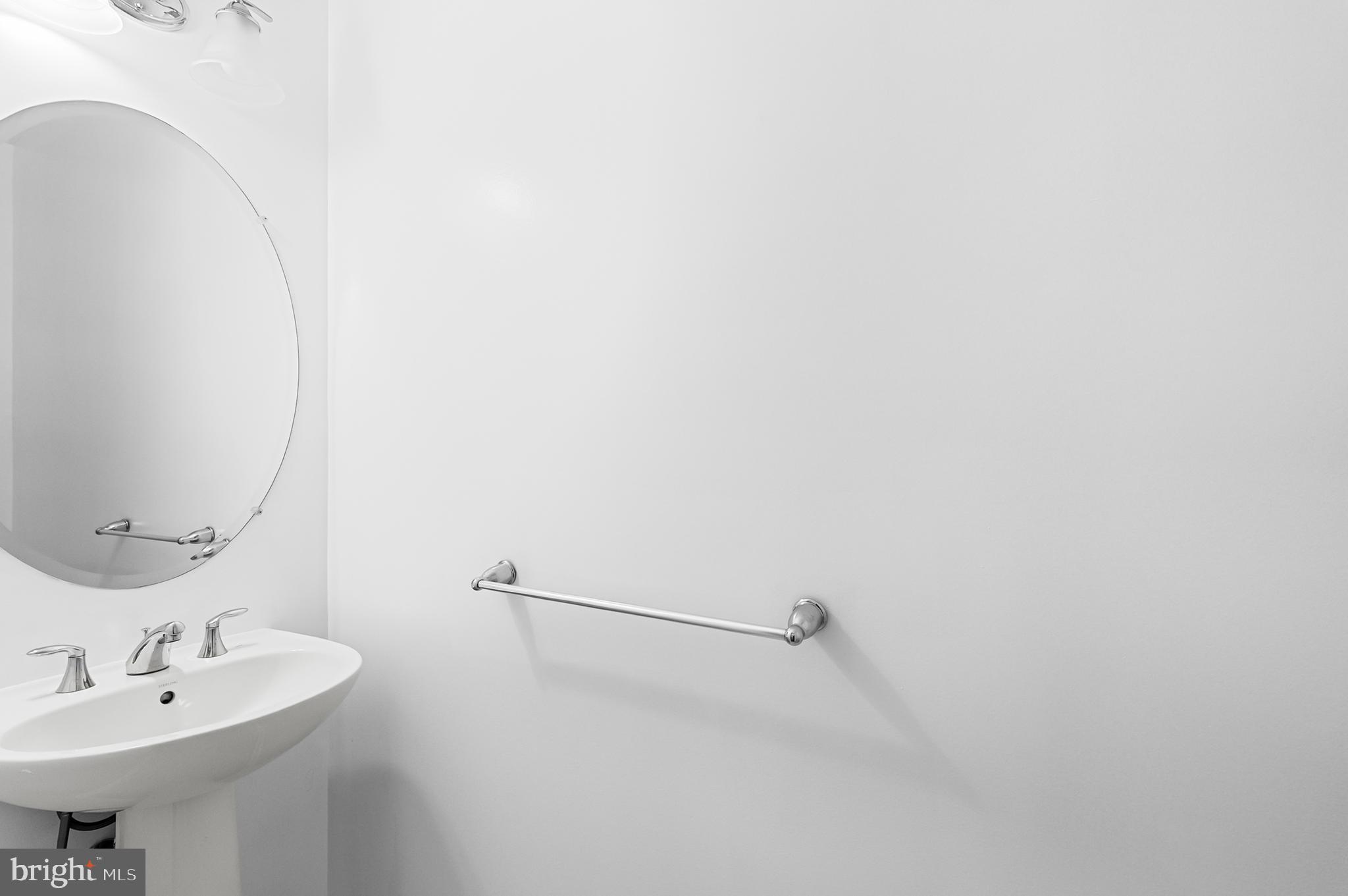 4603 Thoroughbred Drive Upper Marlboro, MD 20772 - Photo 8 of 64 a bathroom with a sink and mirror