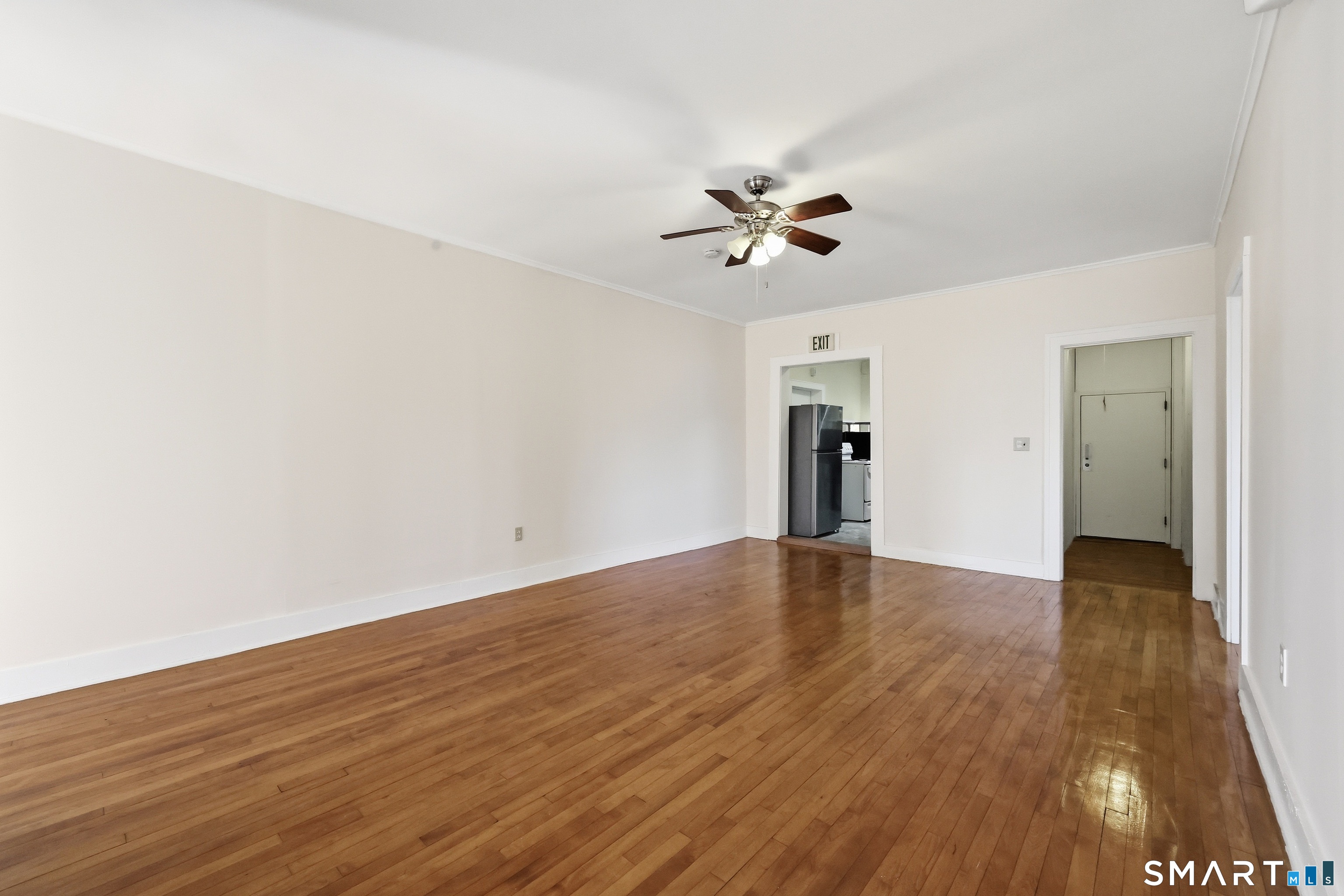 360 Main Street, Unit 3B Middletown, CT 06457 - Photo 14 of 21 a view of empty room with wooden floor and ceiling fan