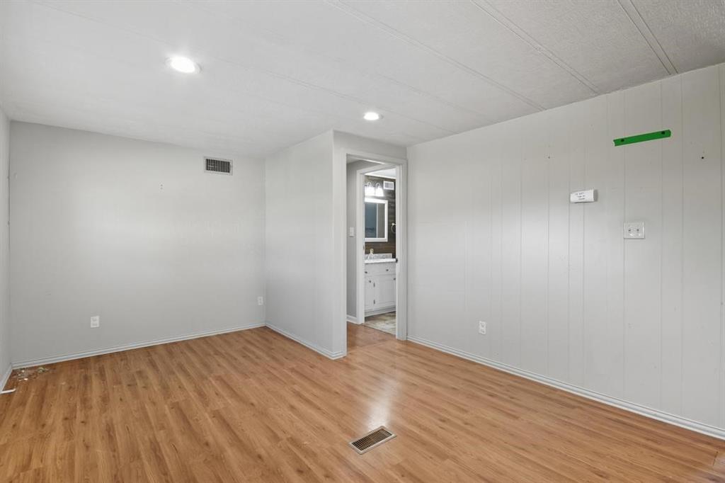 413 Charnel Street Clyde, TX 79510 - Photo 14 of 31 a view of empty room with wooden floor