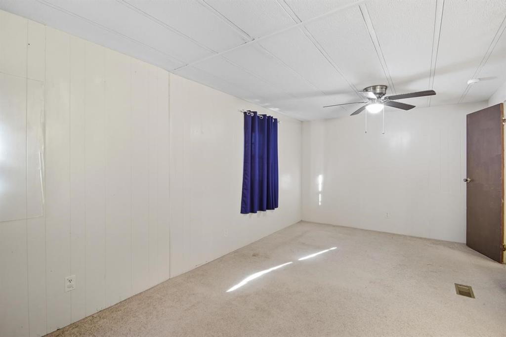 413 Charnel Street Clyde, TX 79510 - Photo 15 of 31 an empty room with windows and fan