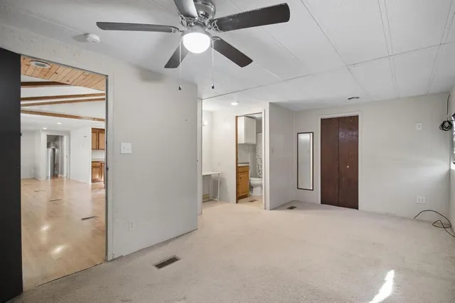 a bathroom with a sink toilet and mirror
