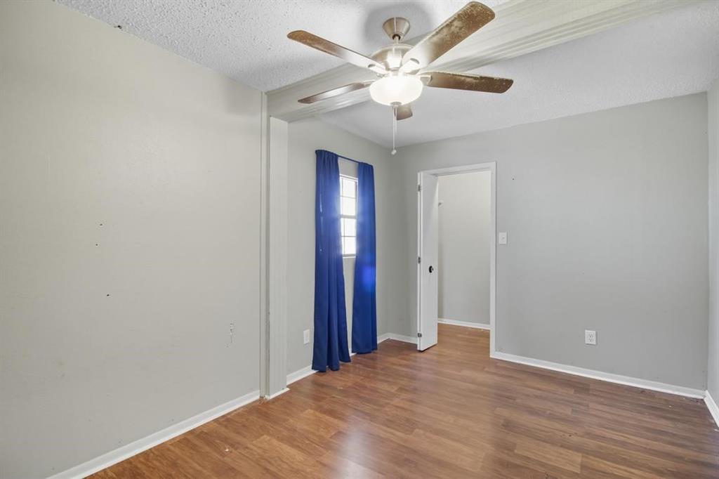 413 Charnel Street Clyde, TX 79510 - Photo 23 of 31 wooden floor in an empty room