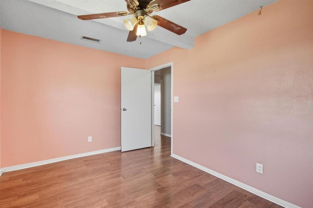 413 Charnel Street Clyde, TX 79510 - Photo 27 of 31 an empty room with a window and a fan