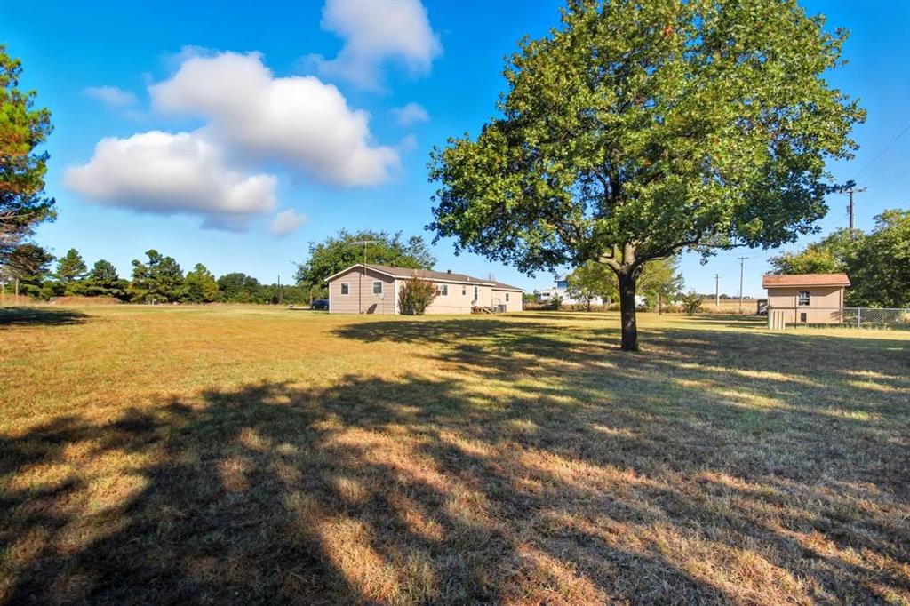 413 Charnel Street Clyde, TX 79510 - Photo 30 of 31 a view of a lake with a yard