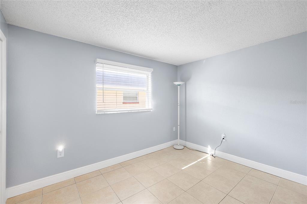 4930 Hazner Street New Port Richey, FL 34652 - Photo 11 of 22 an empty room with a window