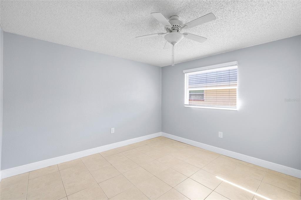4930 Hazner Street New Port Richey, FL 34652 - Photo 14 of 22 an empty room with a window