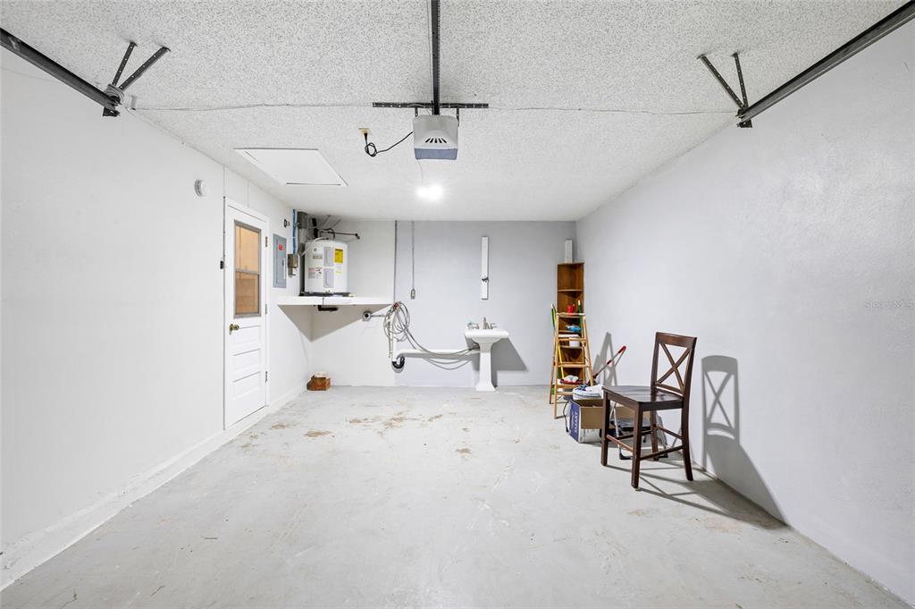 4930 Hazner Street New Port Richey, FL 34652 - Photo 16 of 22 a view of a livingroom with furniture and a ceiling fan