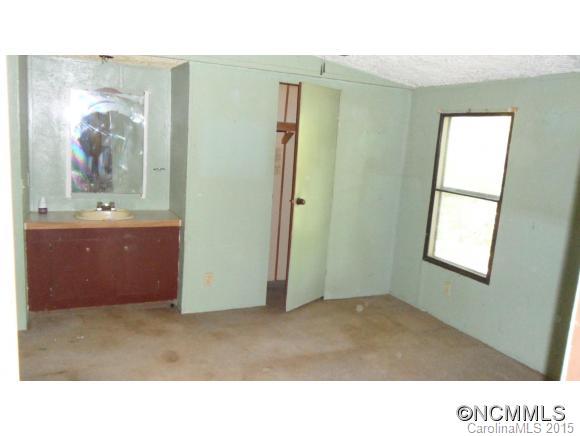 263 Inman Branch Road Waynesville, NC 28786 - Photo 9 of 10 a room with window and wall painting